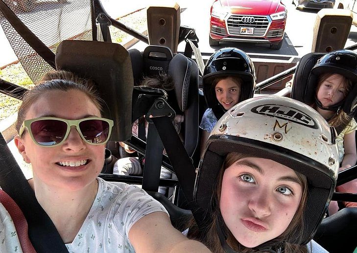 a family photo in a UTV